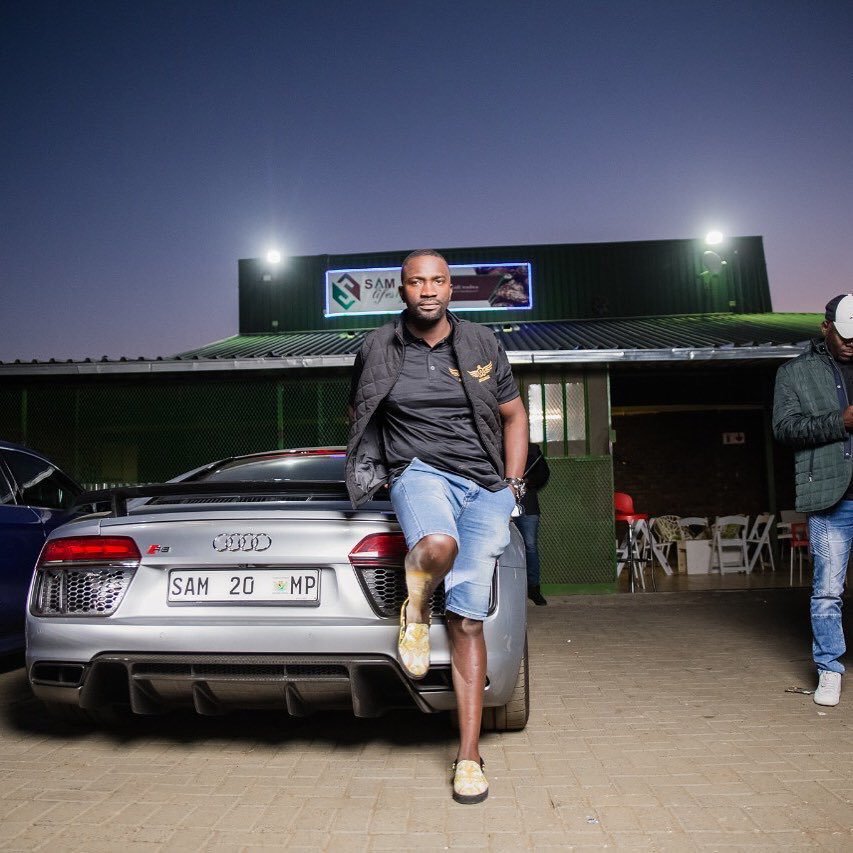 Sam Mshengu poses with his 20th car