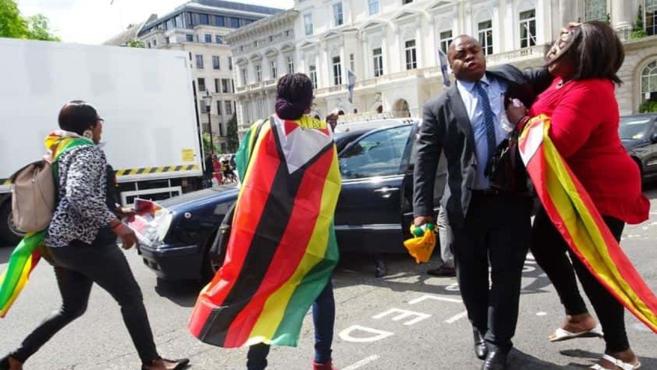 SB-Moyo-gaurds wrestle London Protestors