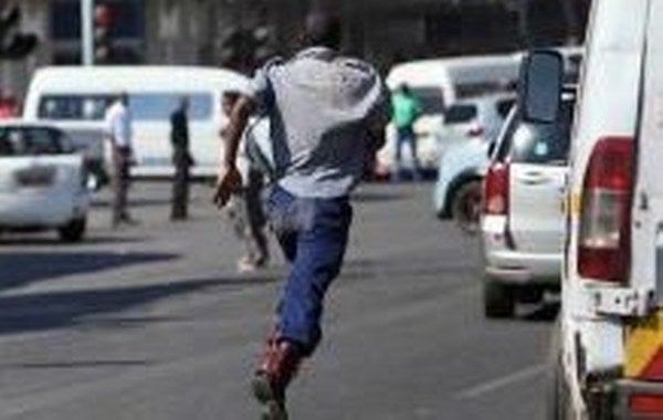 Zimbabwe Republic police ZRP officer running