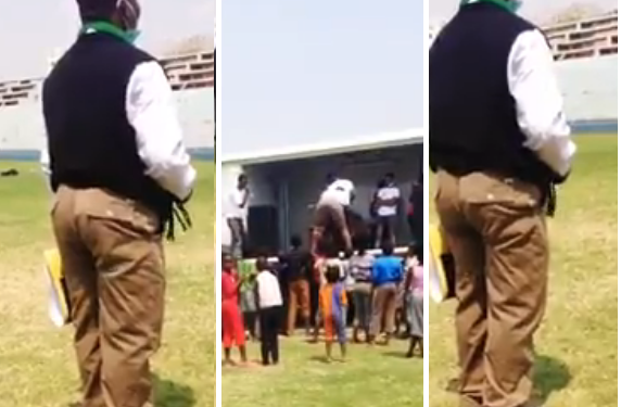 man uses African Bluetooth on dancing woman during show