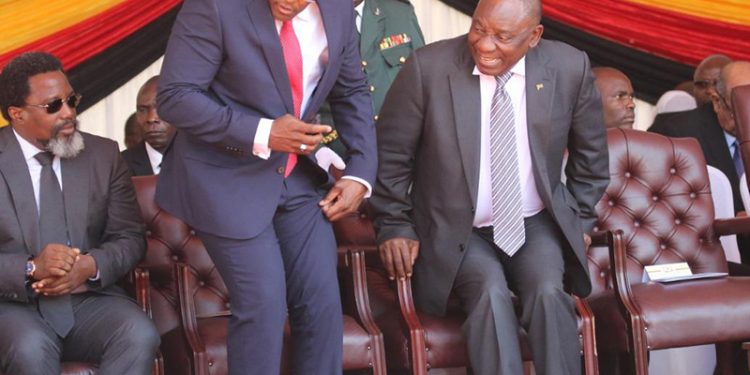 Frank Buyanga with Cyril Ramaphosa, his Kruger coins were seized by SARS