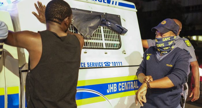 Video Police Officer in full uniform caught looting