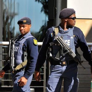 Video Police Officer in full uniform caught looting