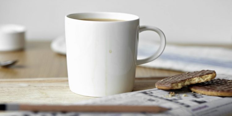 tea-cookies-and-crossword-on-board-royalty-free-image