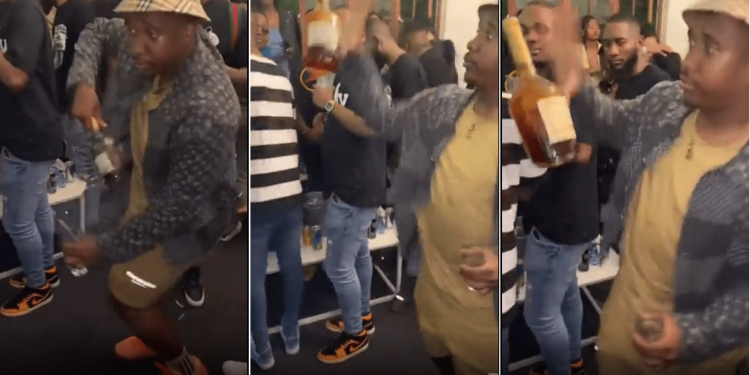 Andile Mpisane spinning a bottle of whiskey. Source Twitter