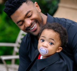 Kim Kholiwe's baby daddy holding Okuhle