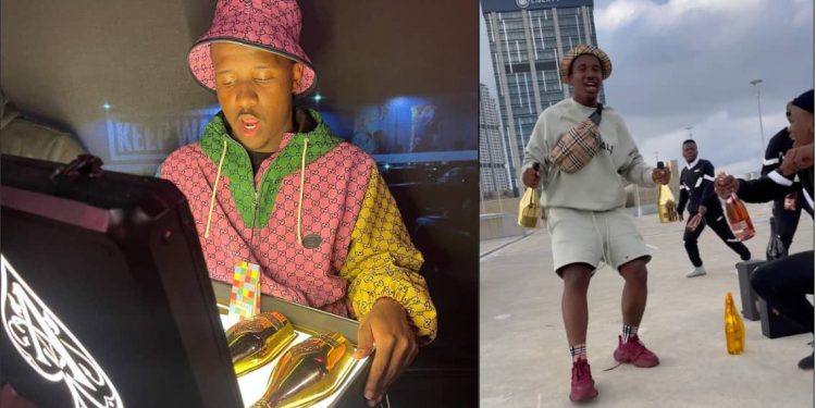 Andile Mpisane pours down expensive champagne