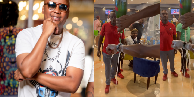 Watch: DJ Mahoota pours expensive champagne on his watch in a club
