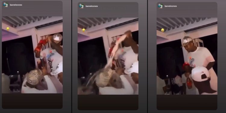 Watch as Andile Mpisane breaks a champagne bottle over friend Shaun Stylist's head