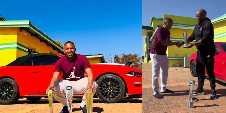 Mamelodi Sundowns coach Steve Komphela presents Andile Jali with the three 2022 PSL Awards