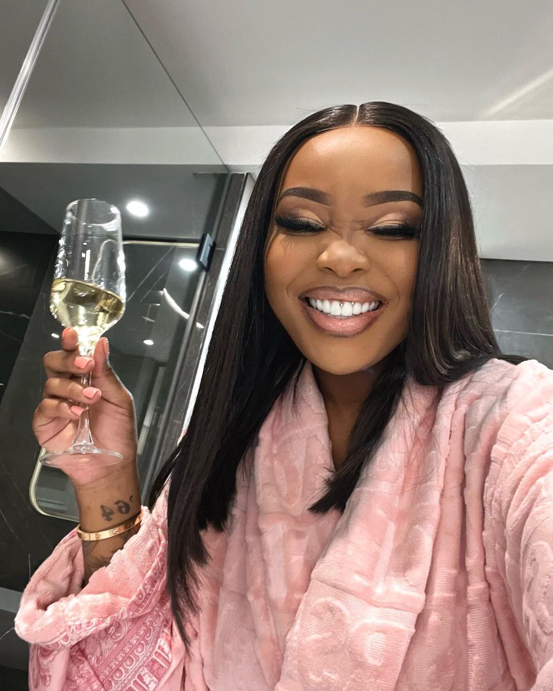 Sithelo Shozi showing off her new teeth