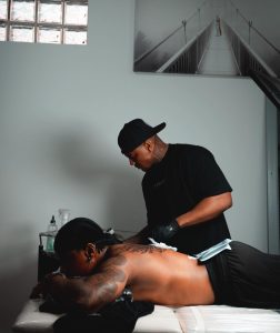 Priddy Ugly getting his tattoo done