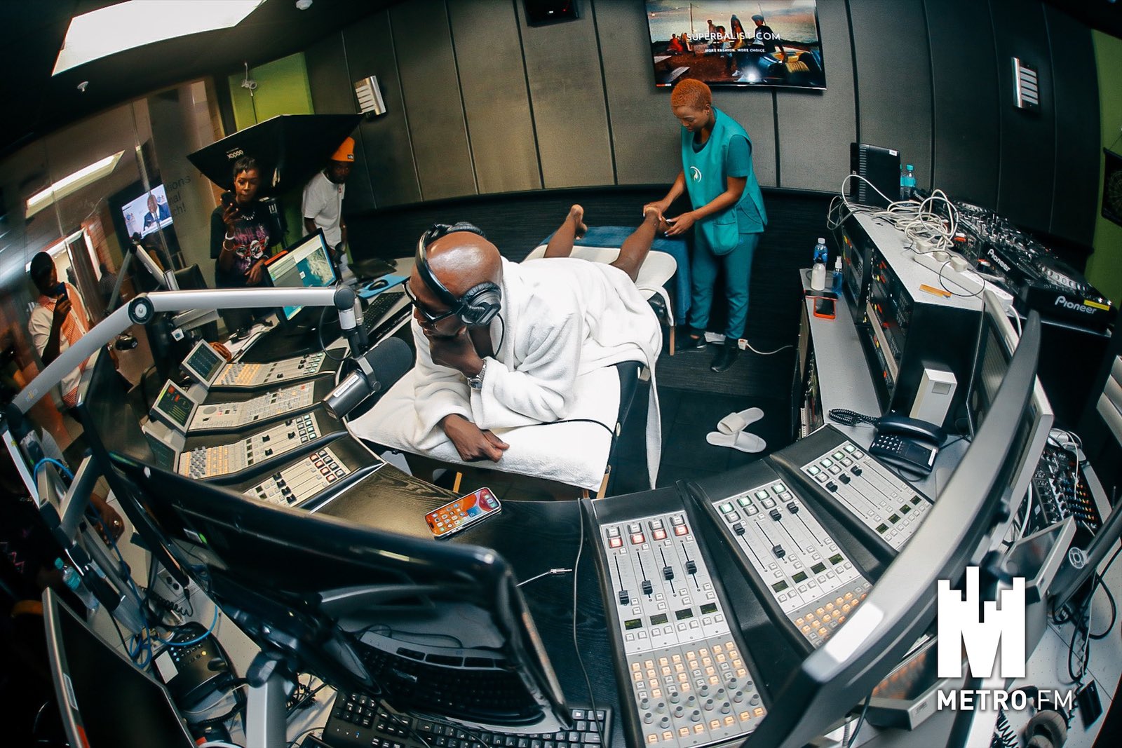 Tbo Touch interviews Zola 7 while receiving a full body massage live on air